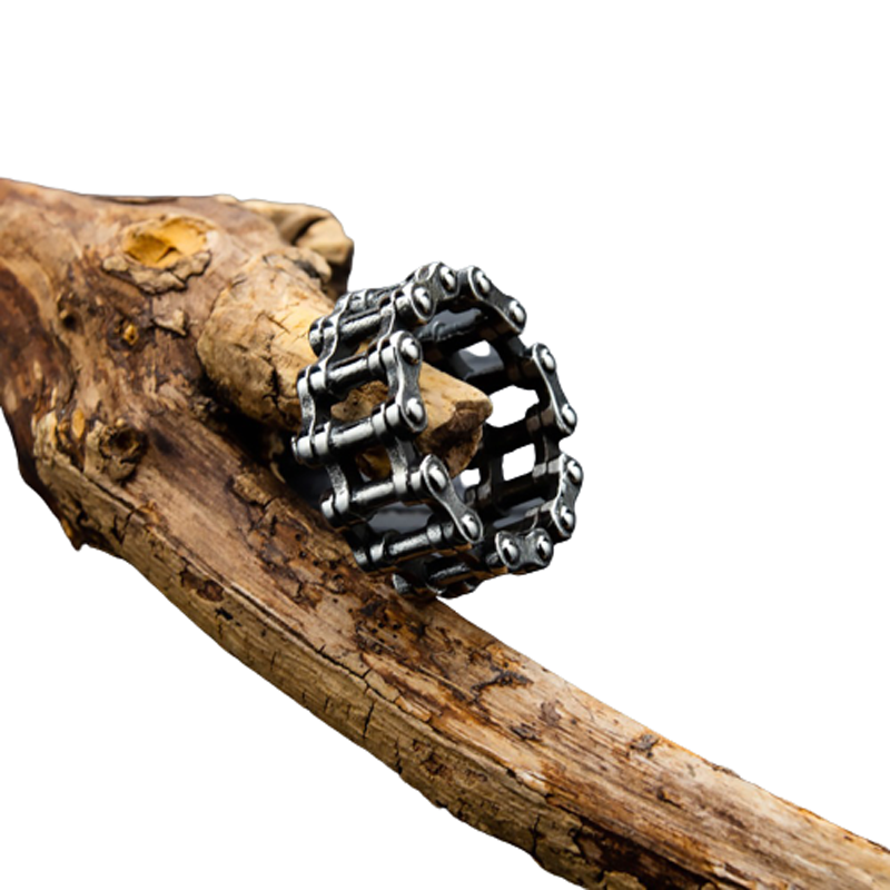 Stylish stainless steel chain ring on rustic wood, perfect accessory for biker and punk rock fashion.