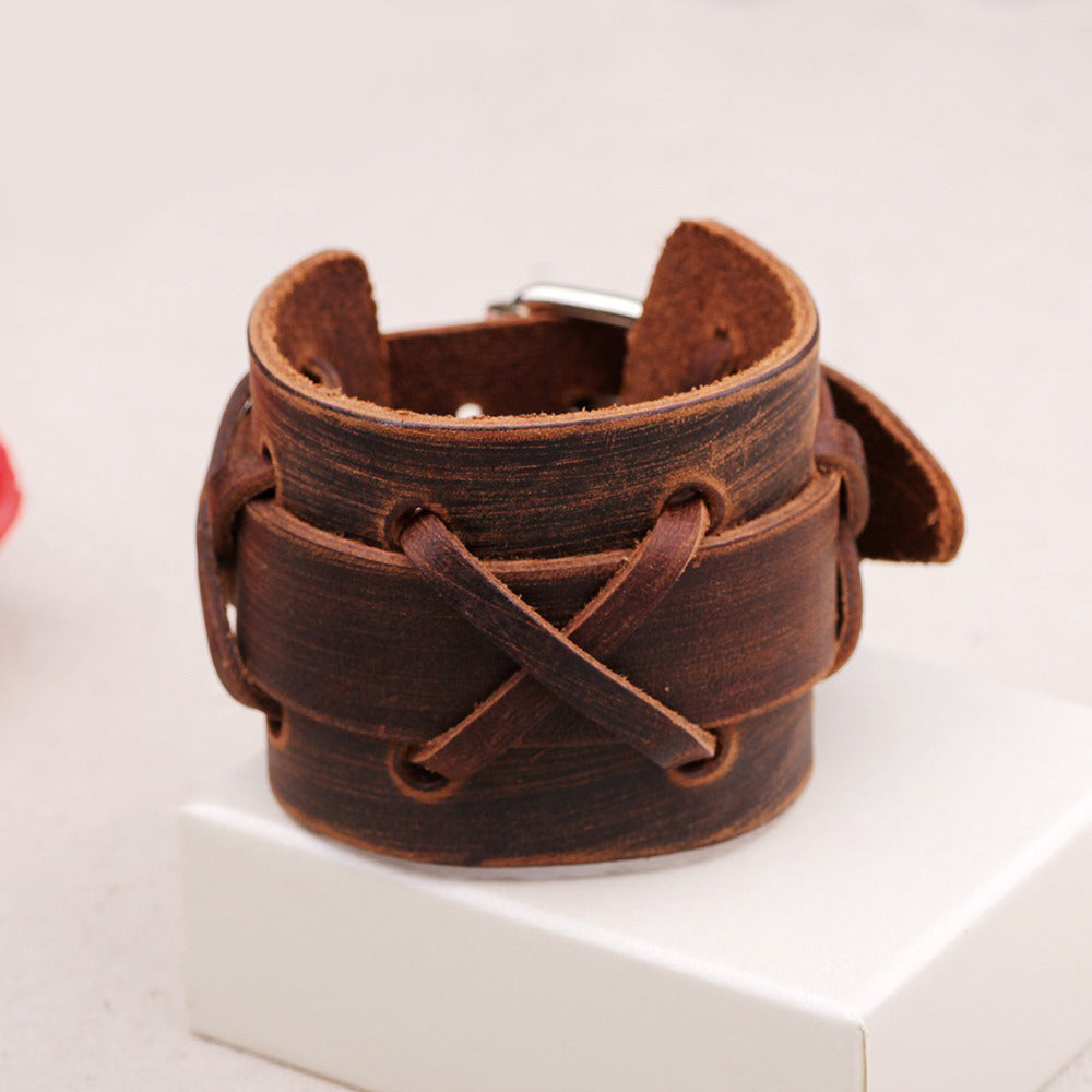 Stylish black and brown genuine leather bracelet with x-type decoration, perfect for rock style outfits.
