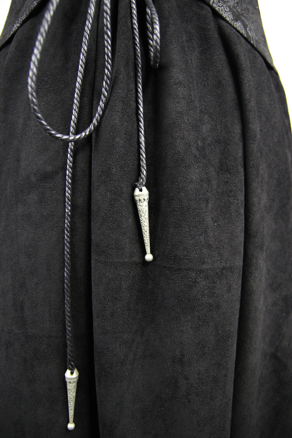 Detail of black long coat's decorative cords with silver tips, perfect for a Gothic style look.