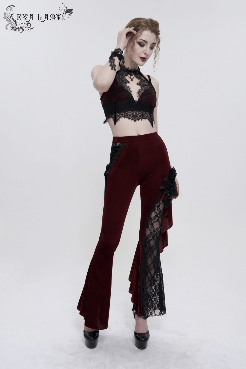 Model wearing a black lace and burgundy velvet halter neck top with matching flared pants, showcasing gothic fashion.