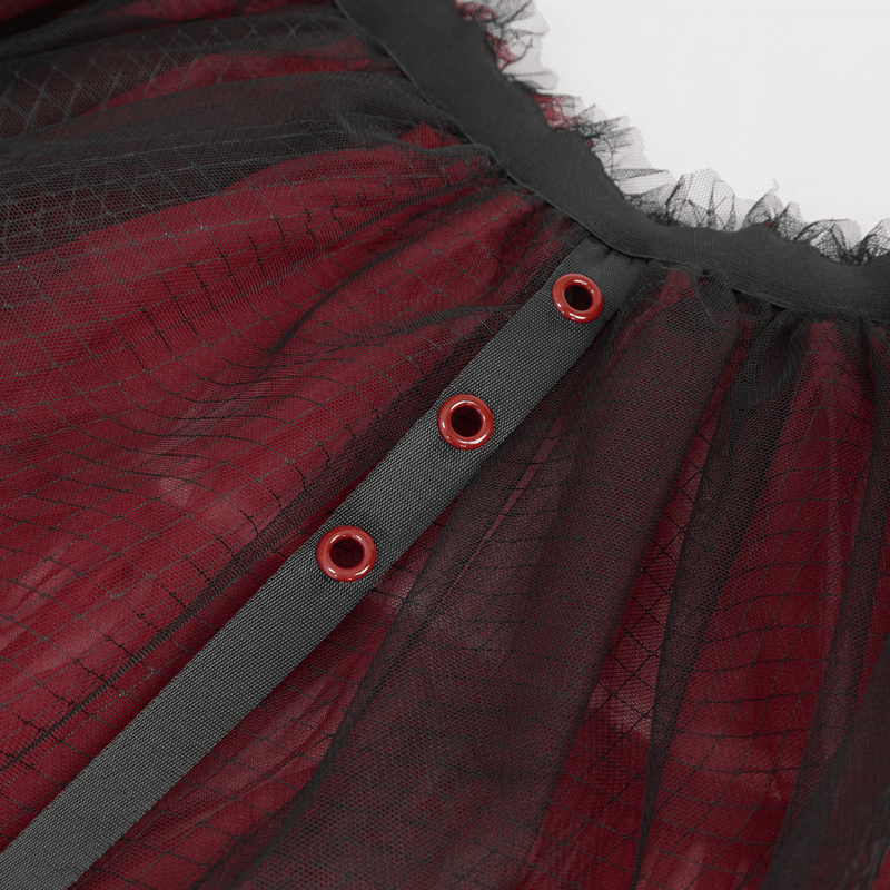 Close-up of black and red mesh skirt featuring a stylish elastic waistband and decorative bowknot for a gothic look.