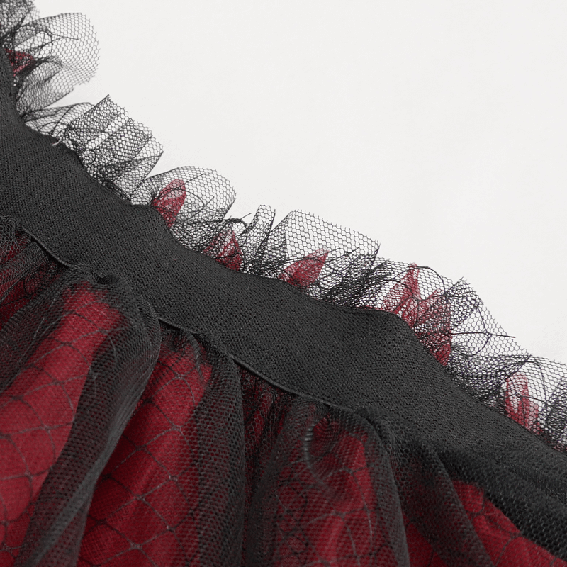 Close-up of the black and red mesh skirt's elastic waistband and ruffled detailing, highlighting Gothic fashion style.