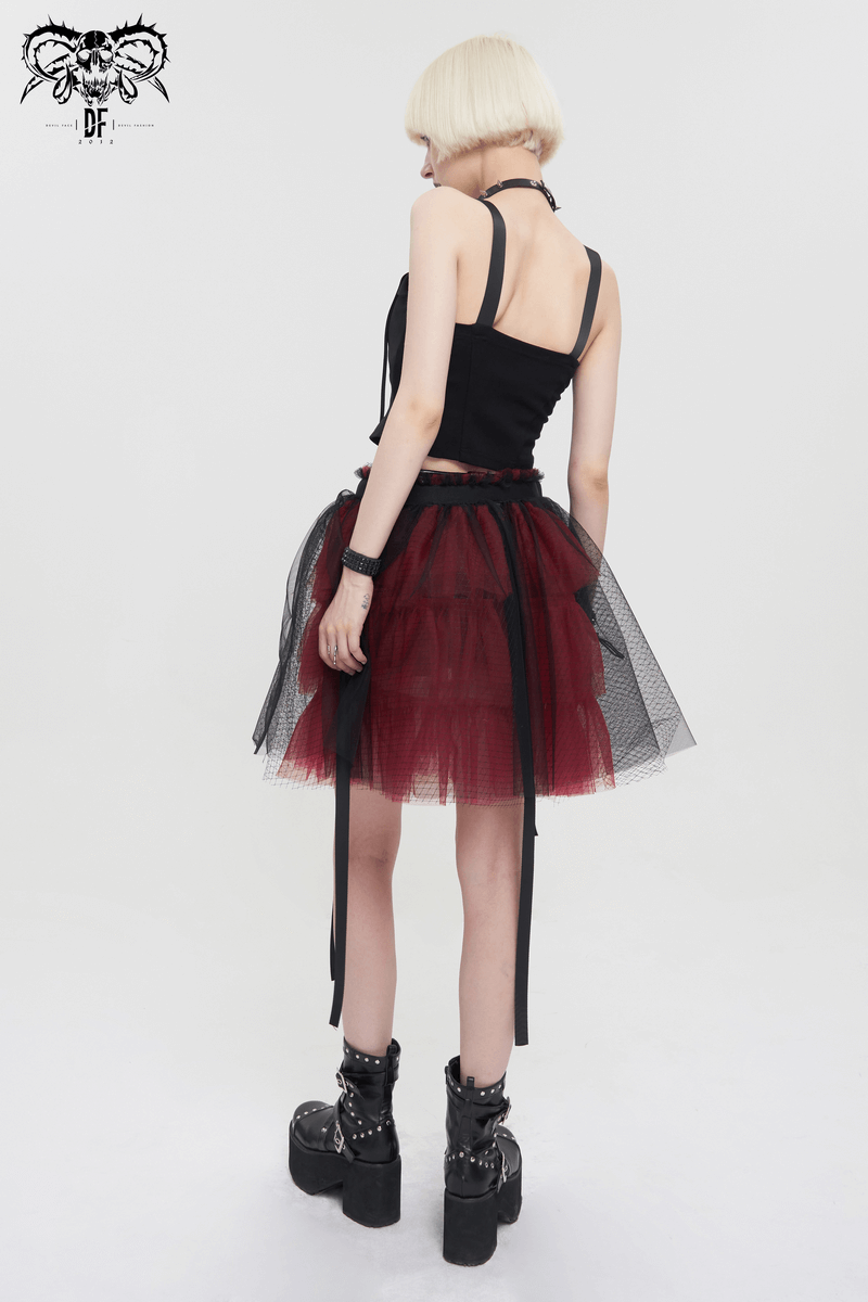 Back view of a model in a black and red short mesh skirt, showcasing a gothic style and trendy design.