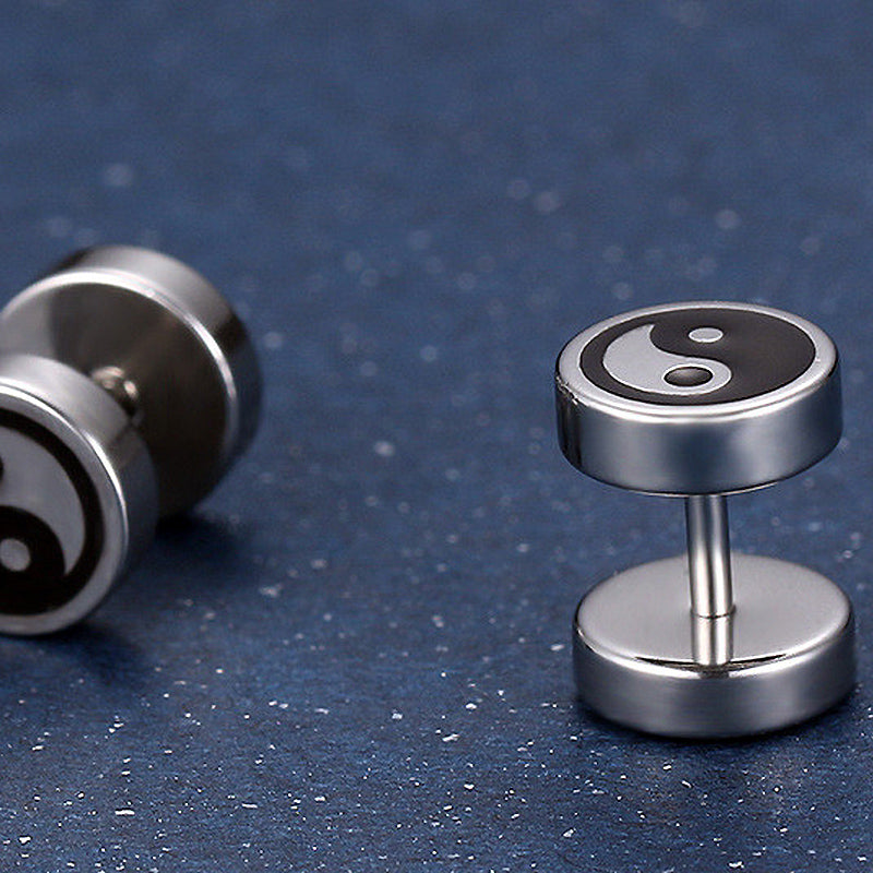 Black and white yin-yang stud earrings in polished stainless steel, perfect unisex accessory for any occasion.