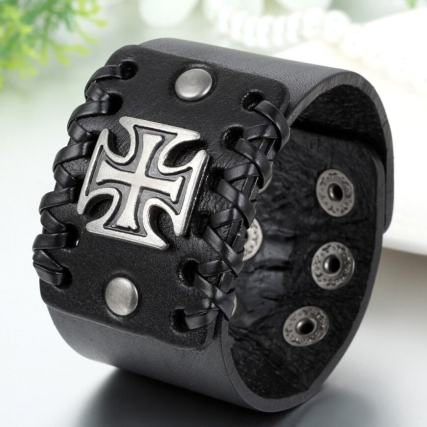 Stylish black leather bracelet featuring Celtic cross design and silver accents, perfect for rock fashion enthusiasts.