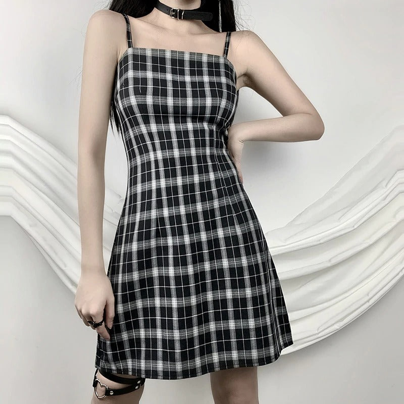 Black and white plaid sleeveless mini dress featuring a strapless neckline - perfect for summer gothic outfits.