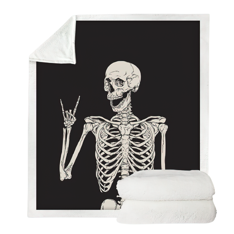 Black and white plush blanket featuring a funny skeleton design, perfect for gothic home decor.