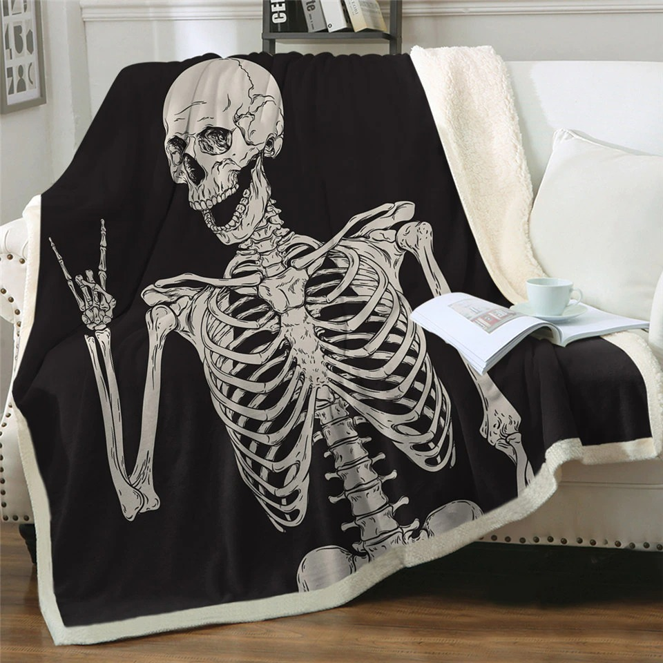 Black and white plush blanket featuring funny skeleton print, perfect gothic decor for sofa or bed.