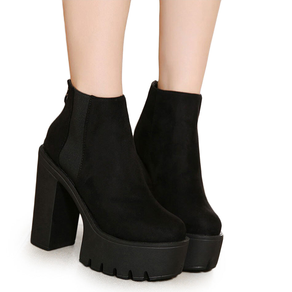 Stylish black platform ankle boots for women with thick square heels and a chic zipper design.