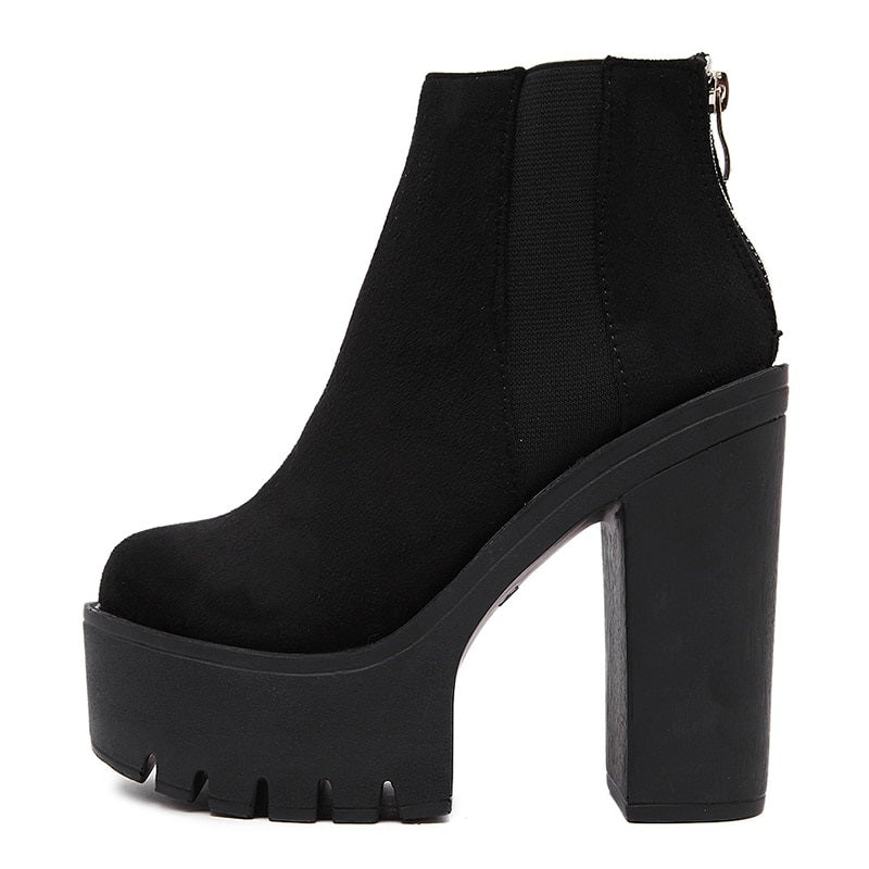 Black ankle boots for women with thick platform heels, stylish zipper detailing and durable rubber sole.