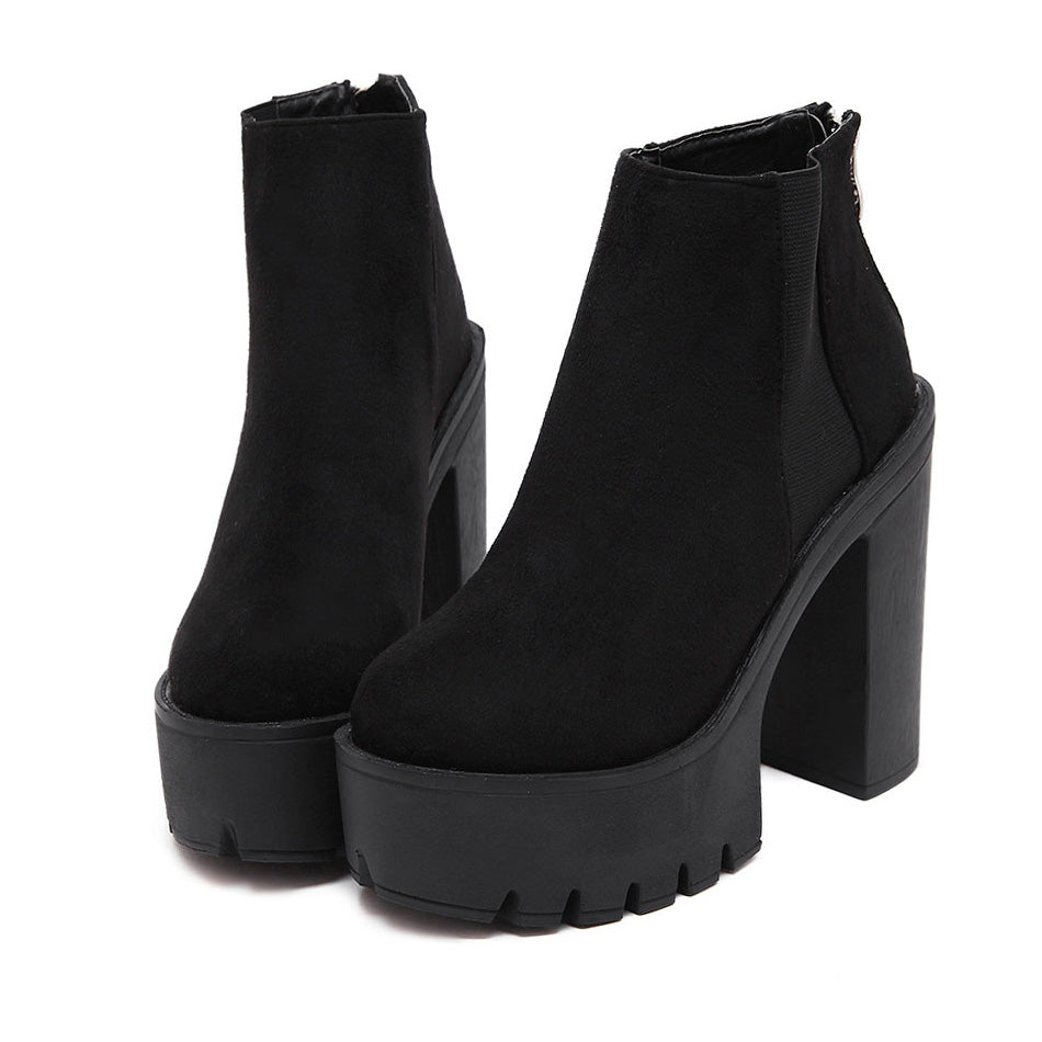 Stylish black ankle boots for women with thick high heels, perfect for rocker outfits and all-season wear.
