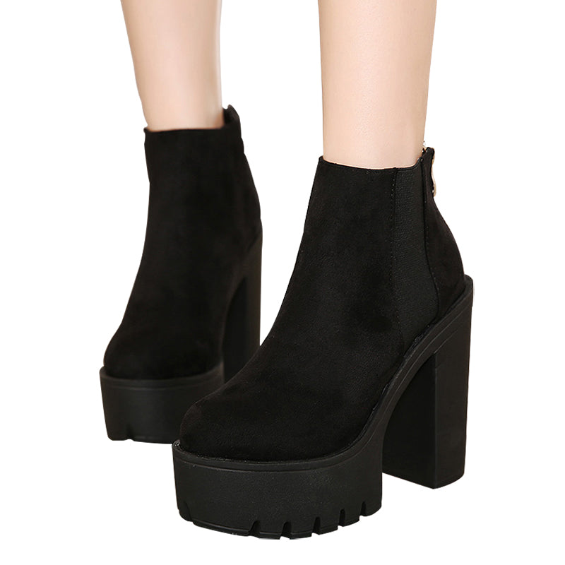 Sleek black ankle boots for women featuring thick platform heels and a stylish zipper, perfect for rocker outfits.