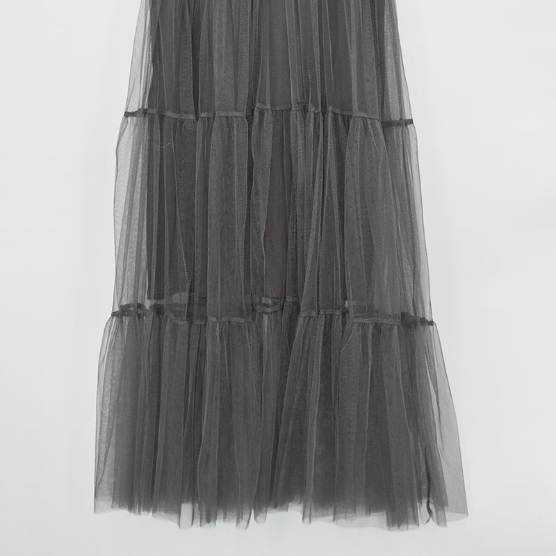 Black asymmetrical mesh dress showing a layered tulle design, perfect for gothic fashion vibes.