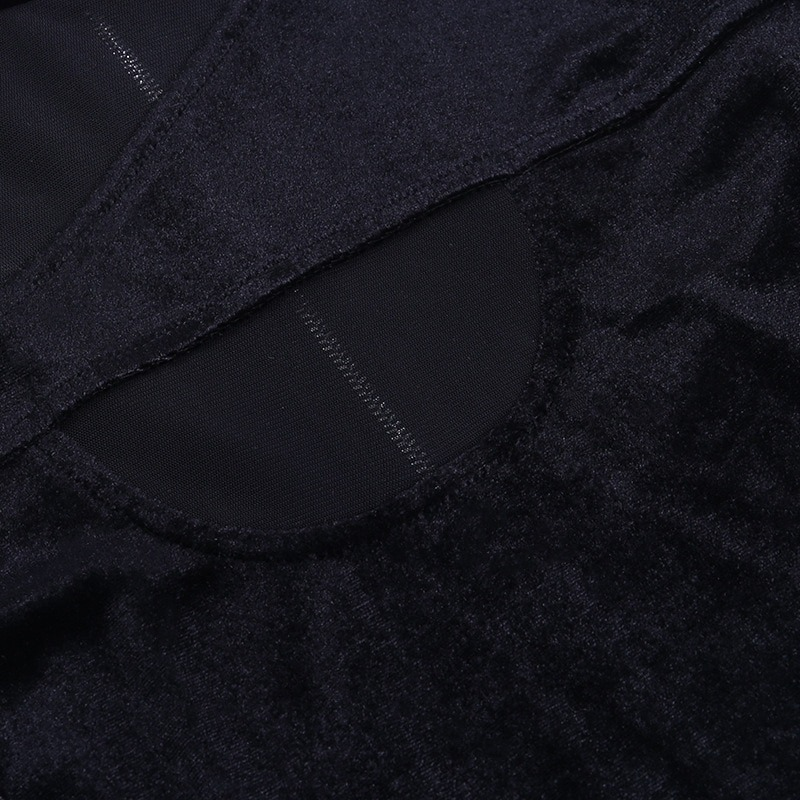 Close-up of black gothic women's top with soft corduroy material and transparent mesh detail.