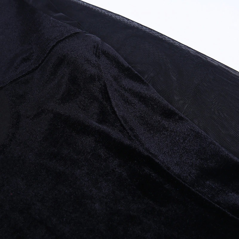 Close-up of black gothic women's top showcasing soft corduroy and transparent mesh details for a stylish look.