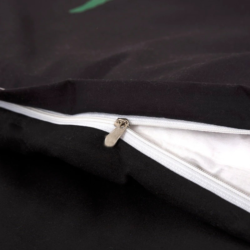 Close-up of black bedding set zipper, showcasing quality craftsmanship in gothic style fashion textiles.