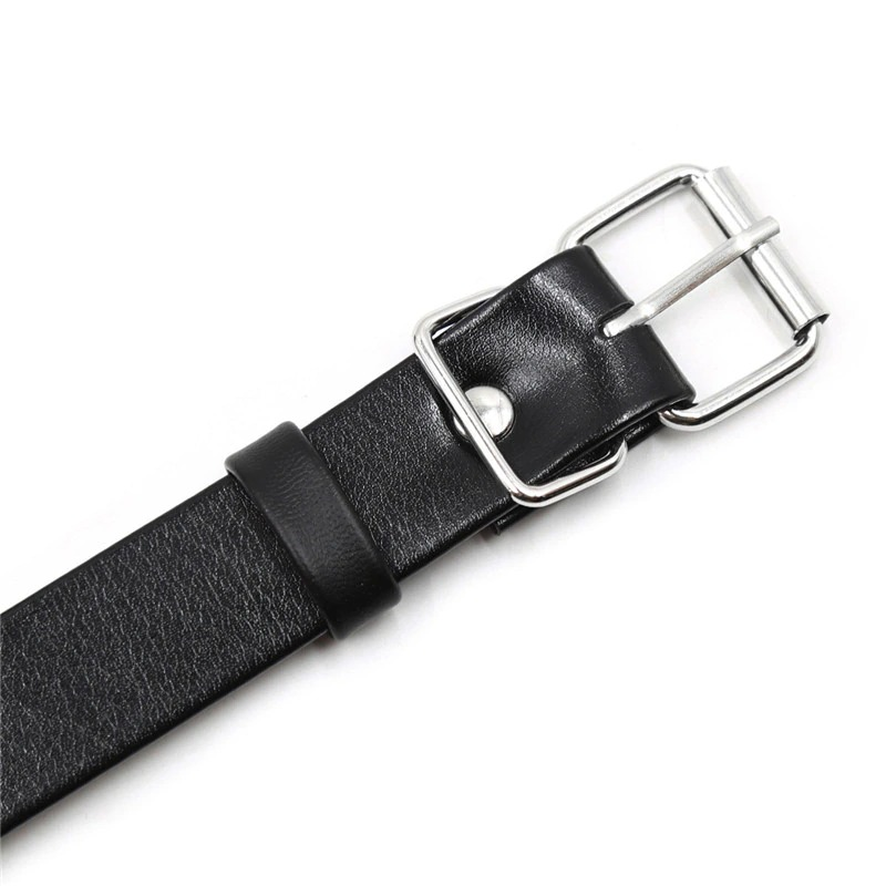 Close-up of a stylish black leather harness strap with a metallic buckle, perfect for alternative fashion and cosplay.