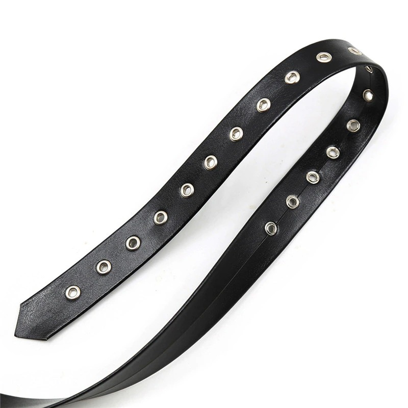 Close-up of a black leather strap with metal eyelets, ideal for bondage suspenders and alternative fashion outfits.