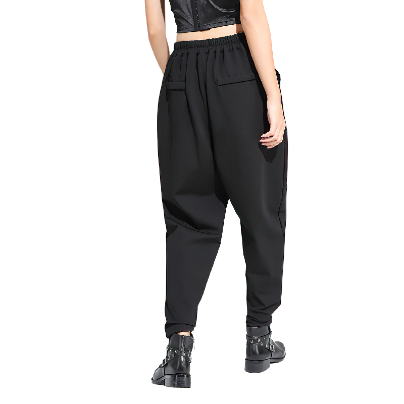 Black high waist harem trousers for women with elasticated waist and pockets, perfect for spring and fall.