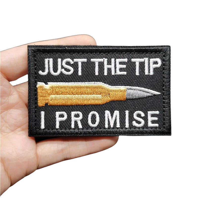 Cool embroidered patch with bullet design featuring the phrase 'Just the Tip I Promise' on a black background