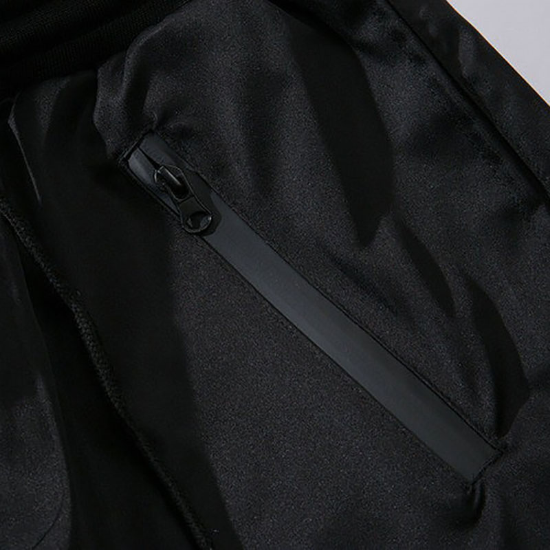 Close-up of the stylish zip pocket on black cotton cargo shorts for men, perfect for casual wear and comfort.