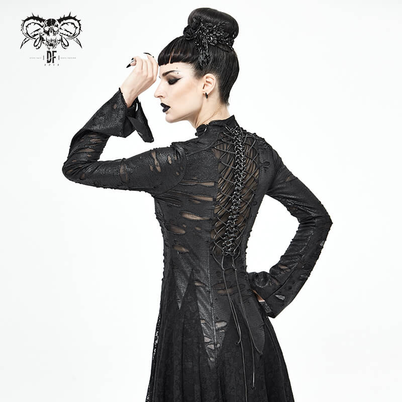 Back view of a model wearing a black lace Gothic dress with intricate lacing details and a flowing hem.