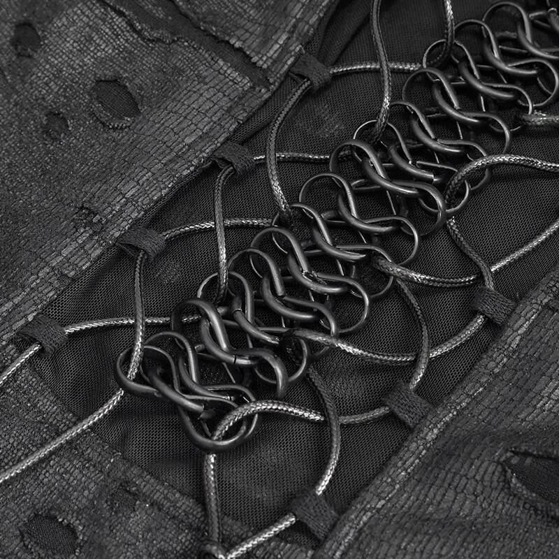 Close-up of intricate lace and metal detailing on a gothic black dress, showcasing its unique design.