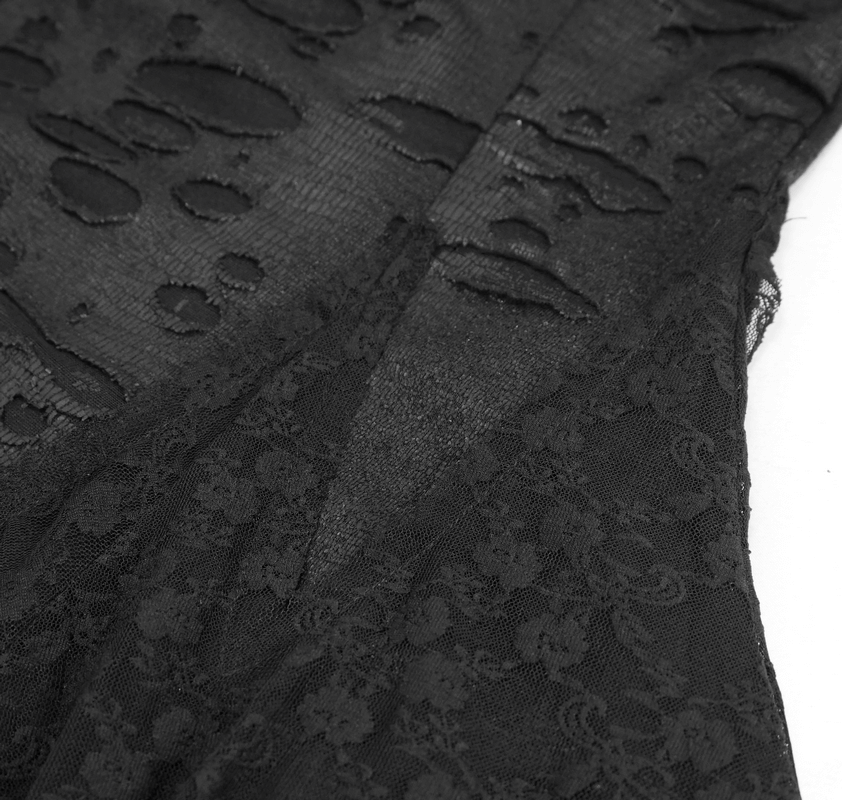 Close-up of the intricate lace detailing and torn inserts on a black Gothic dress, highlighting its unique style.