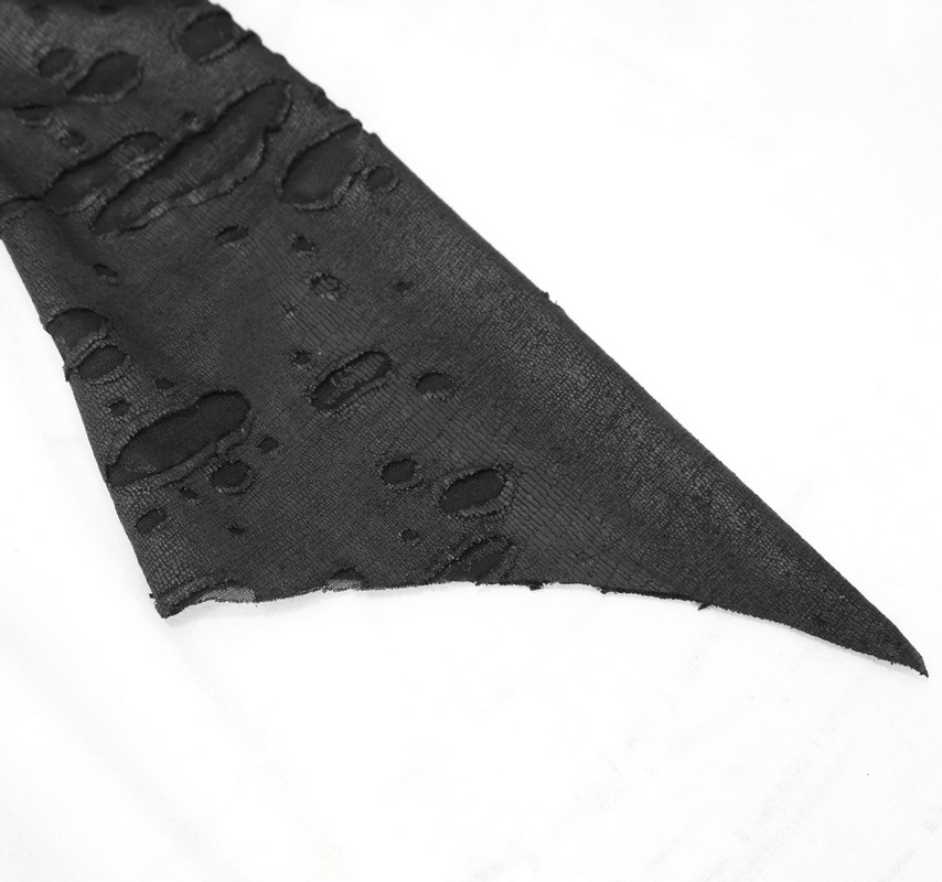 Close-up of the torn lace fabric showcasing the edgy detail of the black 'Dragon Spine' gothic dress.
