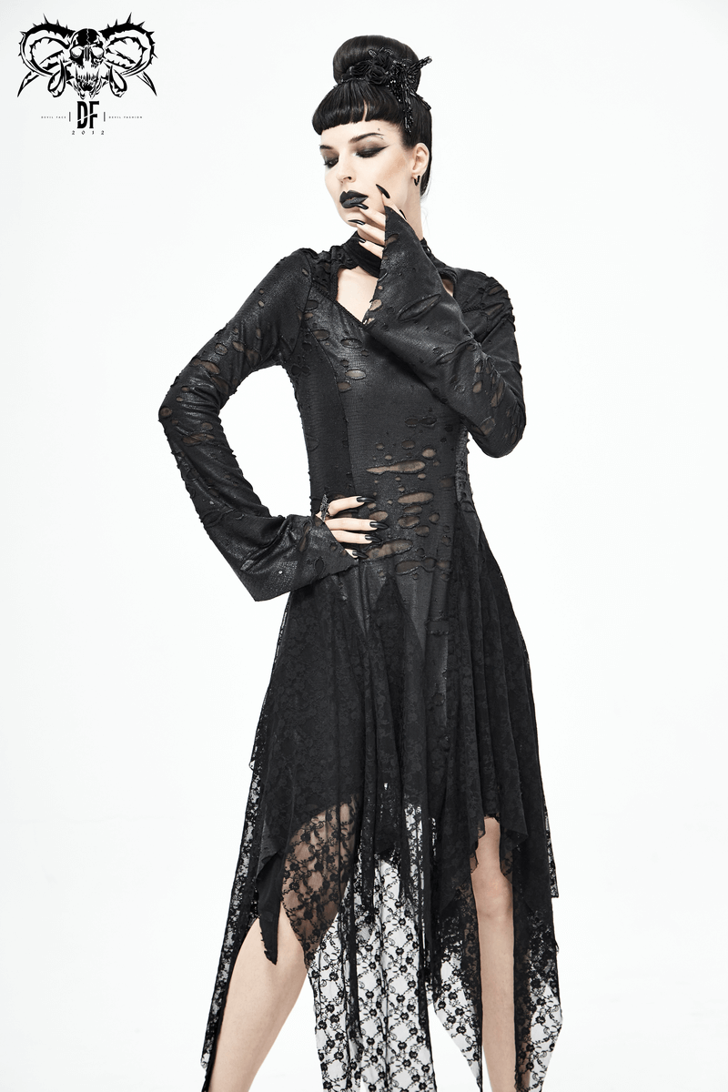 Model in long black 'Dragon Spine' Gothic dress showcasing lace details and irregular hem.