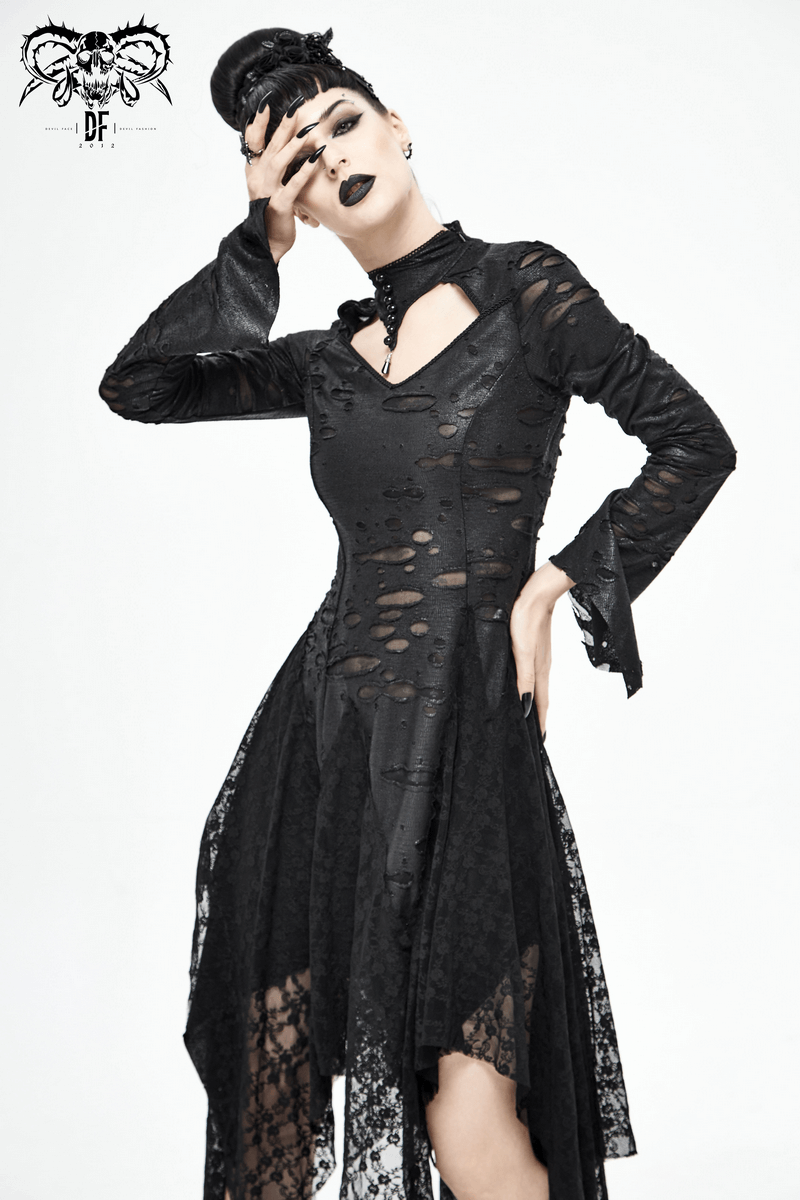 Elegant model wearing a long black 'Dragon Spine' gothic dress with lace and torn inserts, showcasing a dark, stylish look.
