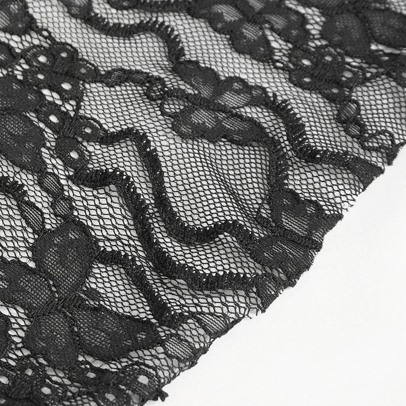 Close-up of intricate black lace fabric with floral appliqué design perfect for an elegant retro long dress.
