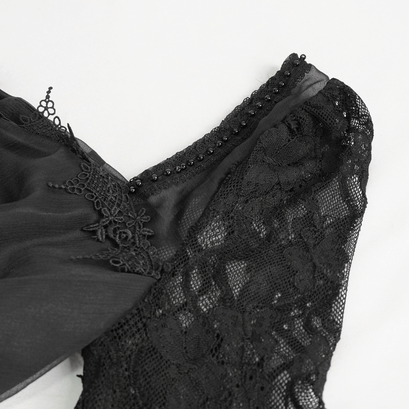 Close-up of the square neck and lace details of a black elegant retro long dress for women.