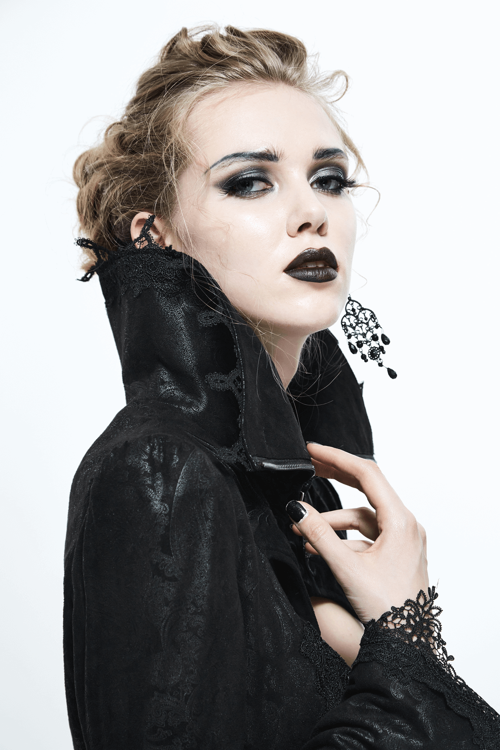 Model showcasing a Black Embossed Gothic Long Coat with a high collar, exuding Victorian elegance and bold alternative fashion.