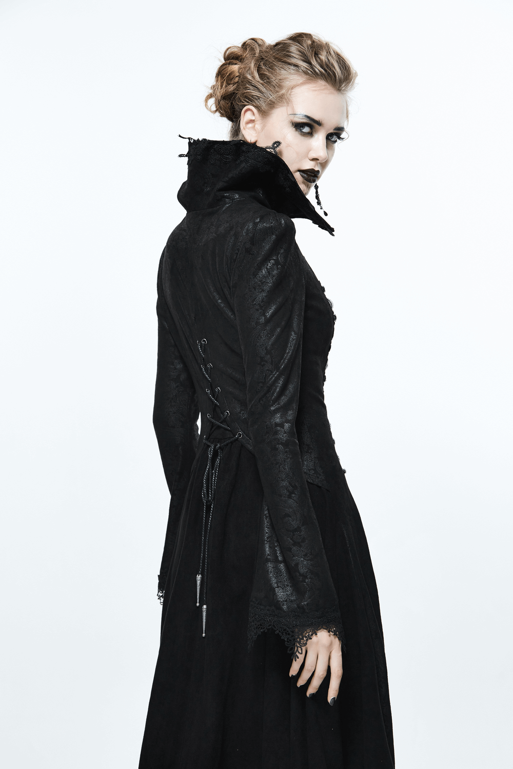 Elegant black embossed Gothic long coat with high collar and lace accents, showcasing alternative fashion style.
