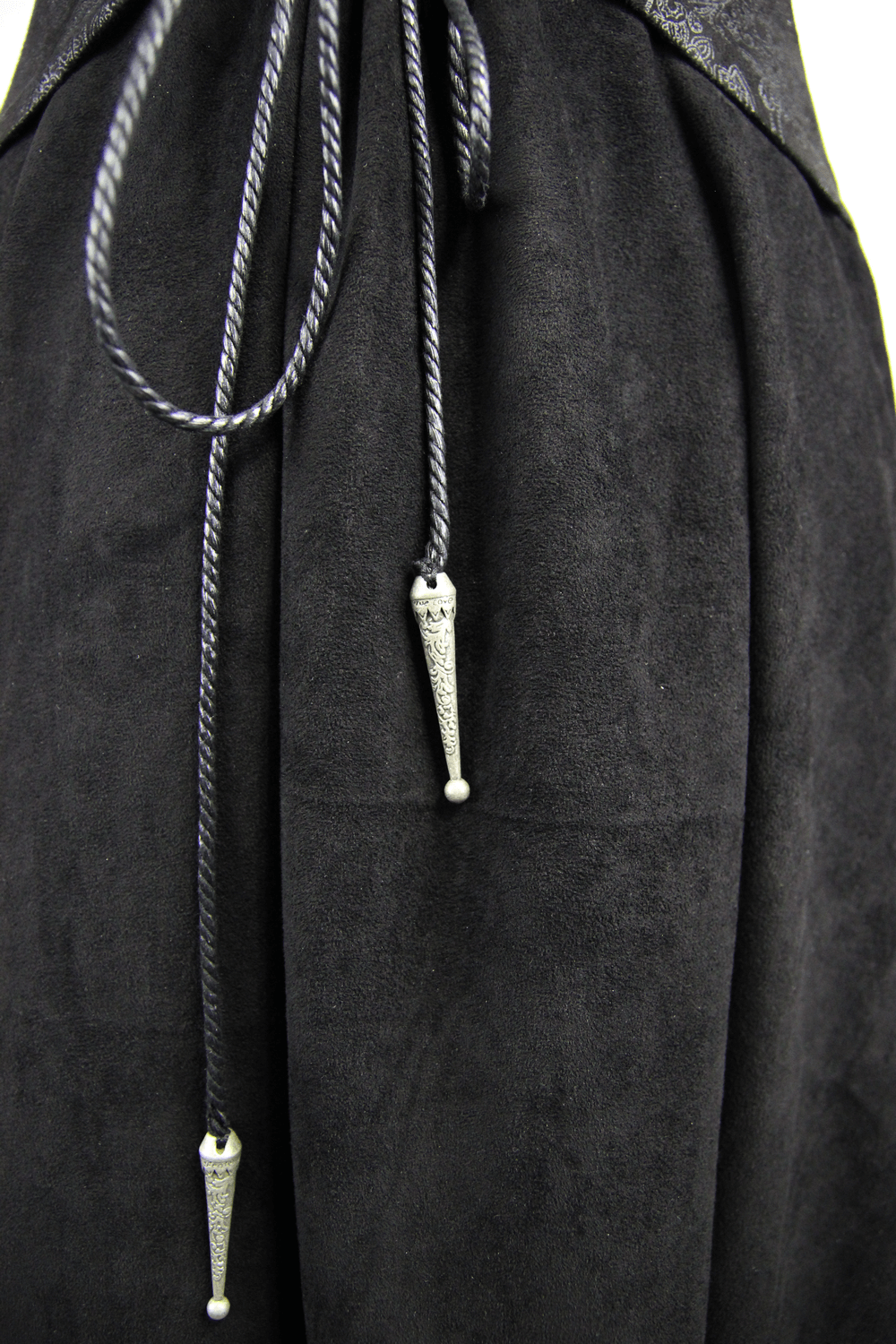 Close-up of the black embossed long coat showcasing elegant silver accents and unique drawstrings, embodying Gothic style.