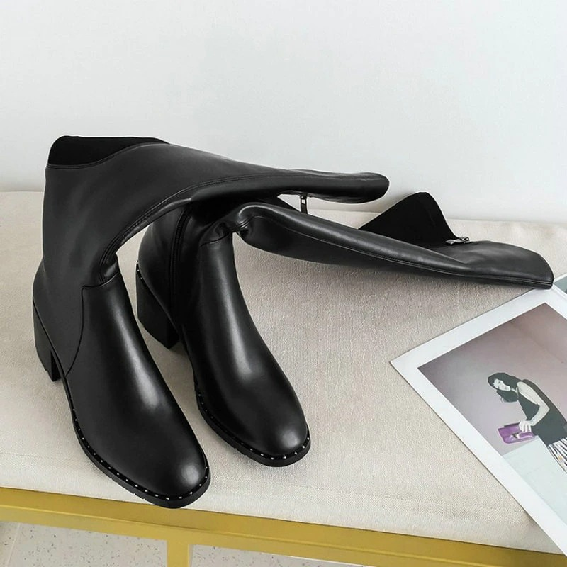 Black genuine leather women's knee-high boots with round toe and stylish design, perfect for casual elegance.