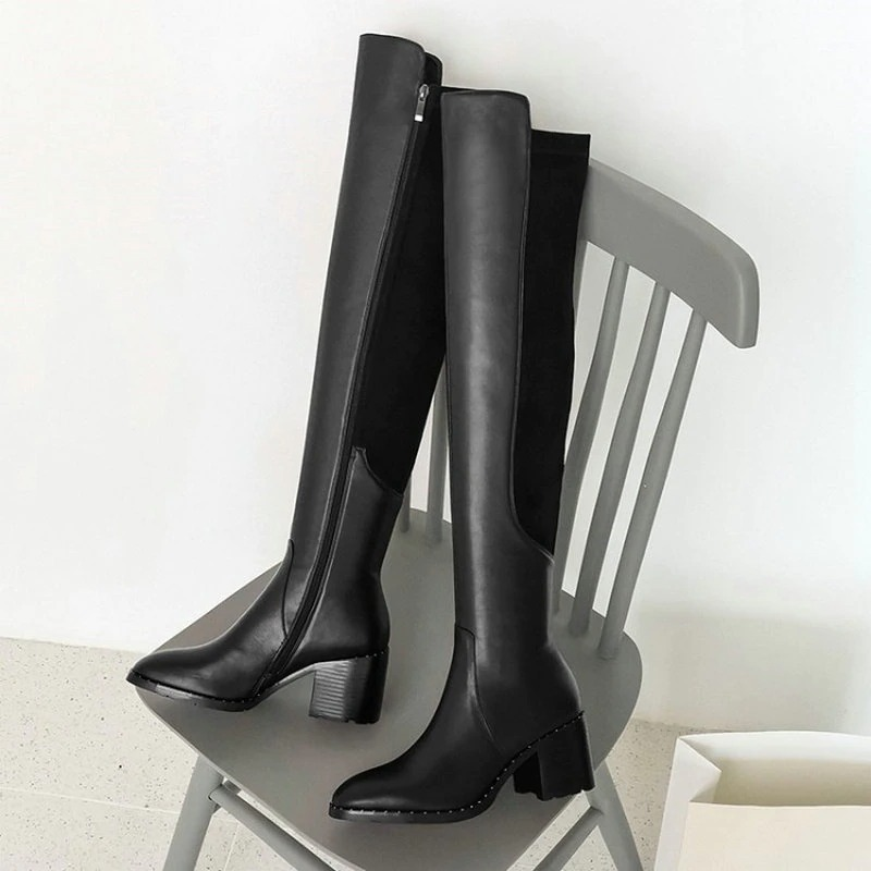 Elegant black leather knee-high women's boots with a stylish round toe and zip detail, perfect for casual and trendy outfits.
