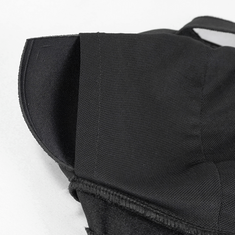 Close-up of black gothic bikini top with lace-up detail and mesh insert for stylish beach wear.