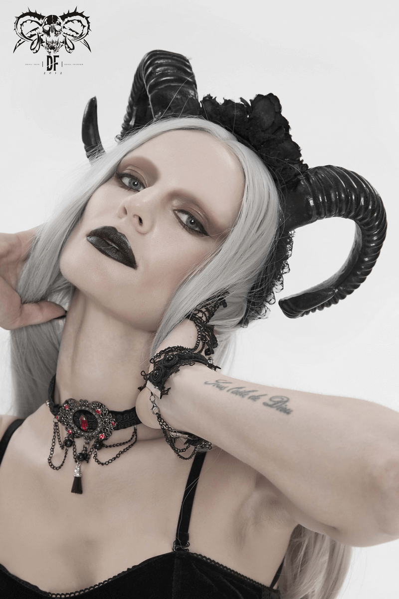 Stylish black gothic devil horn headdress on model with gray hair and bold makeup, perfect for edgy fashion statements.