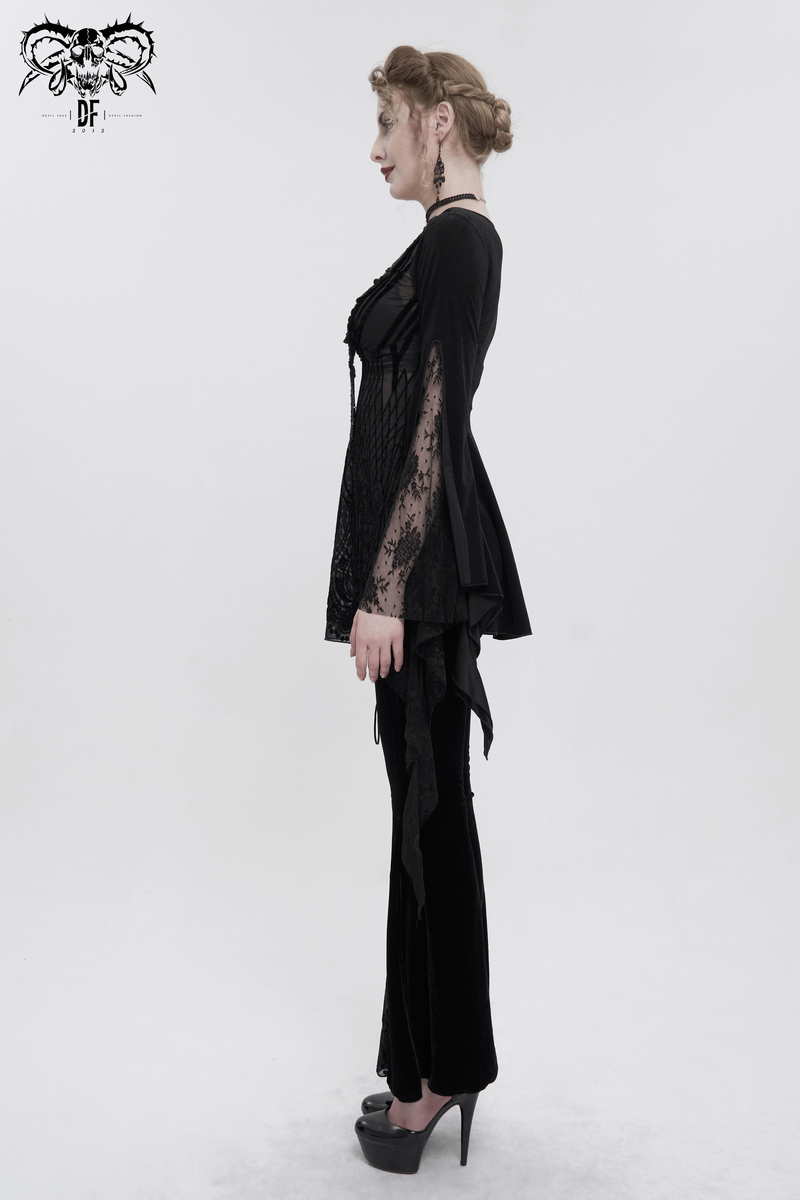 Stylish woman in a black gothic lace top with tassels and long trumpet sleeves, showcasing a luxury look.