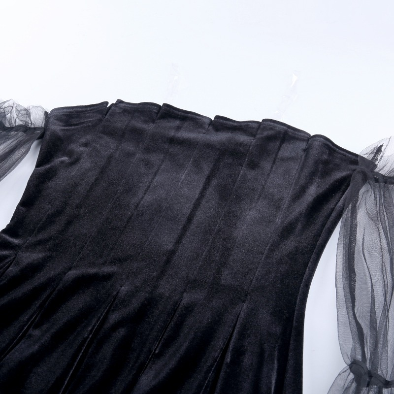 Black Gothic mini dress fabric close-up, showcasing pleats and sheer mesh sleeves for a punk rock style.