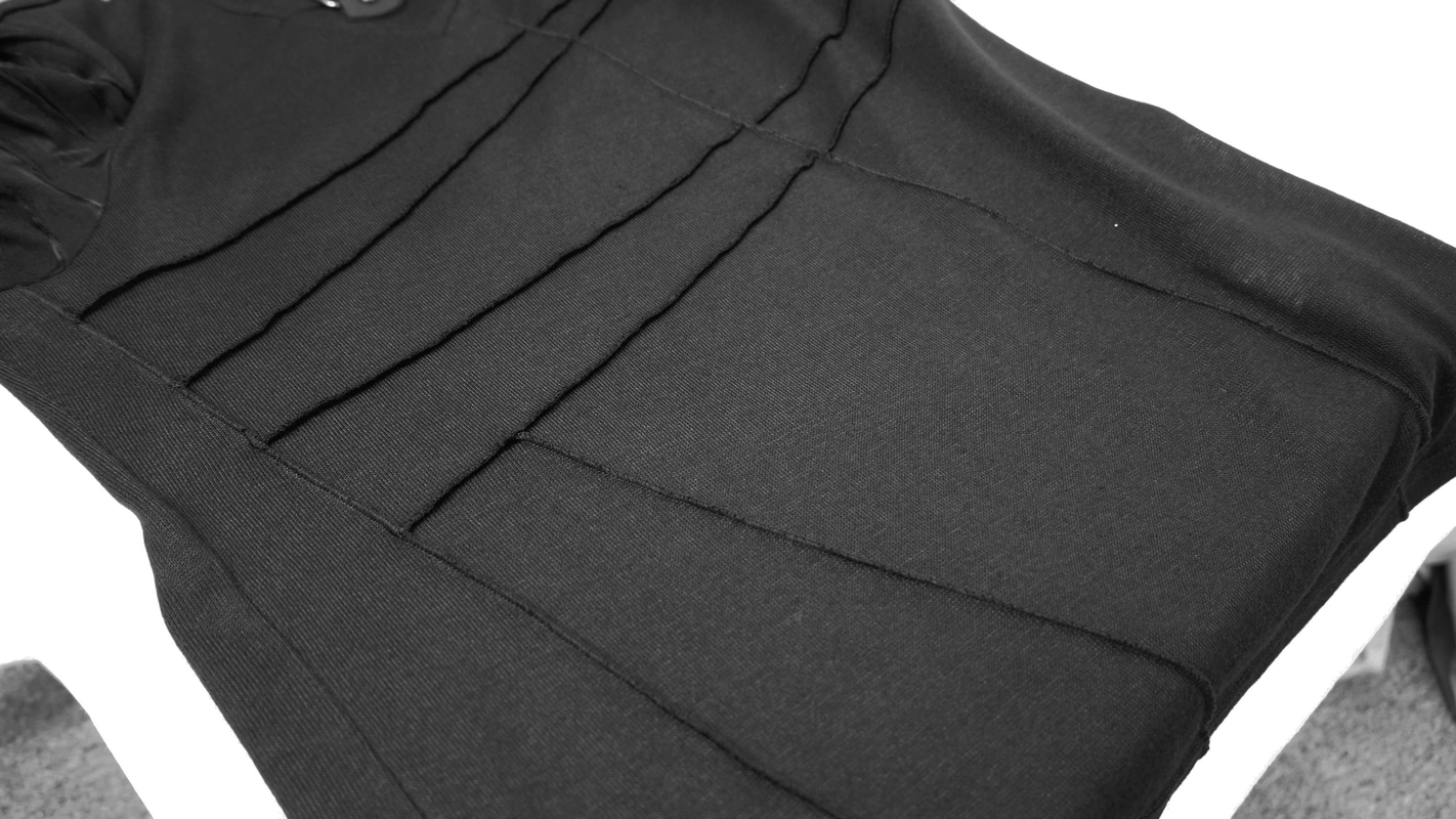 Black gothic punk hoodie showcasing stylish buckle and long sleeves design on a flat surface.