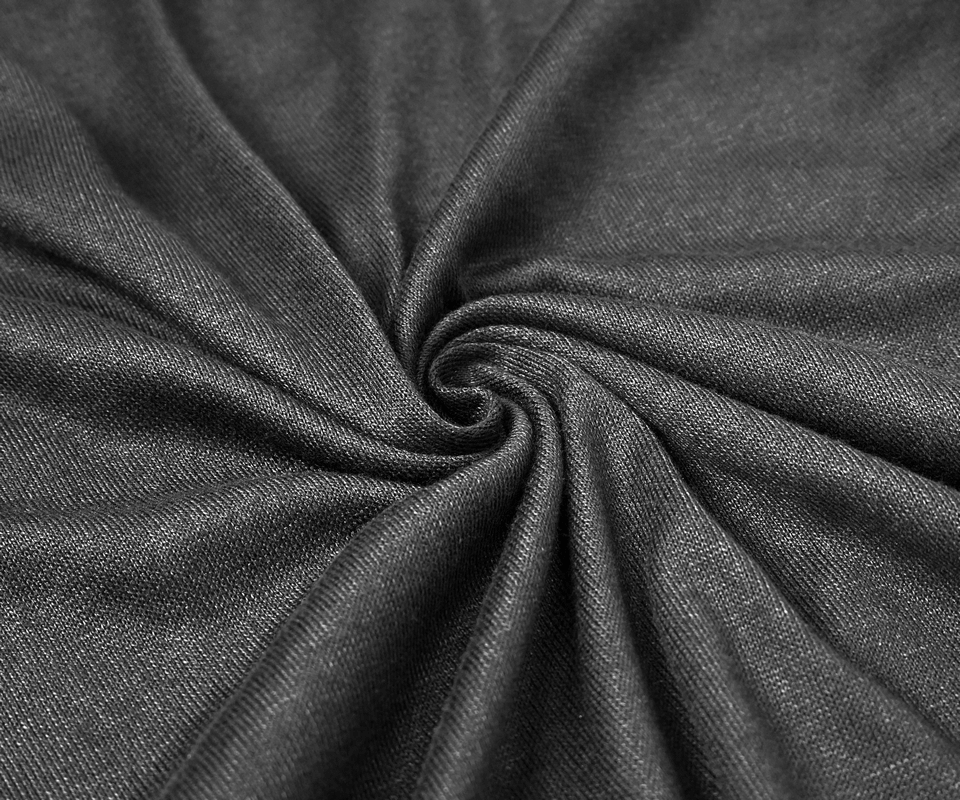 Close-up of soft black fabric, showcasing the texture perfect for a men's gothic punk hoodie.