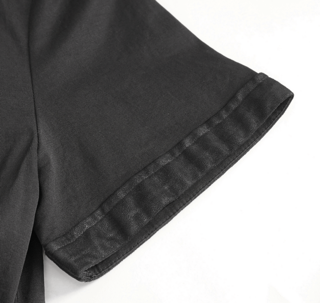Close-up of the short sleeve hem of a black gothic punk shirt for men, showcasing stylish design details.