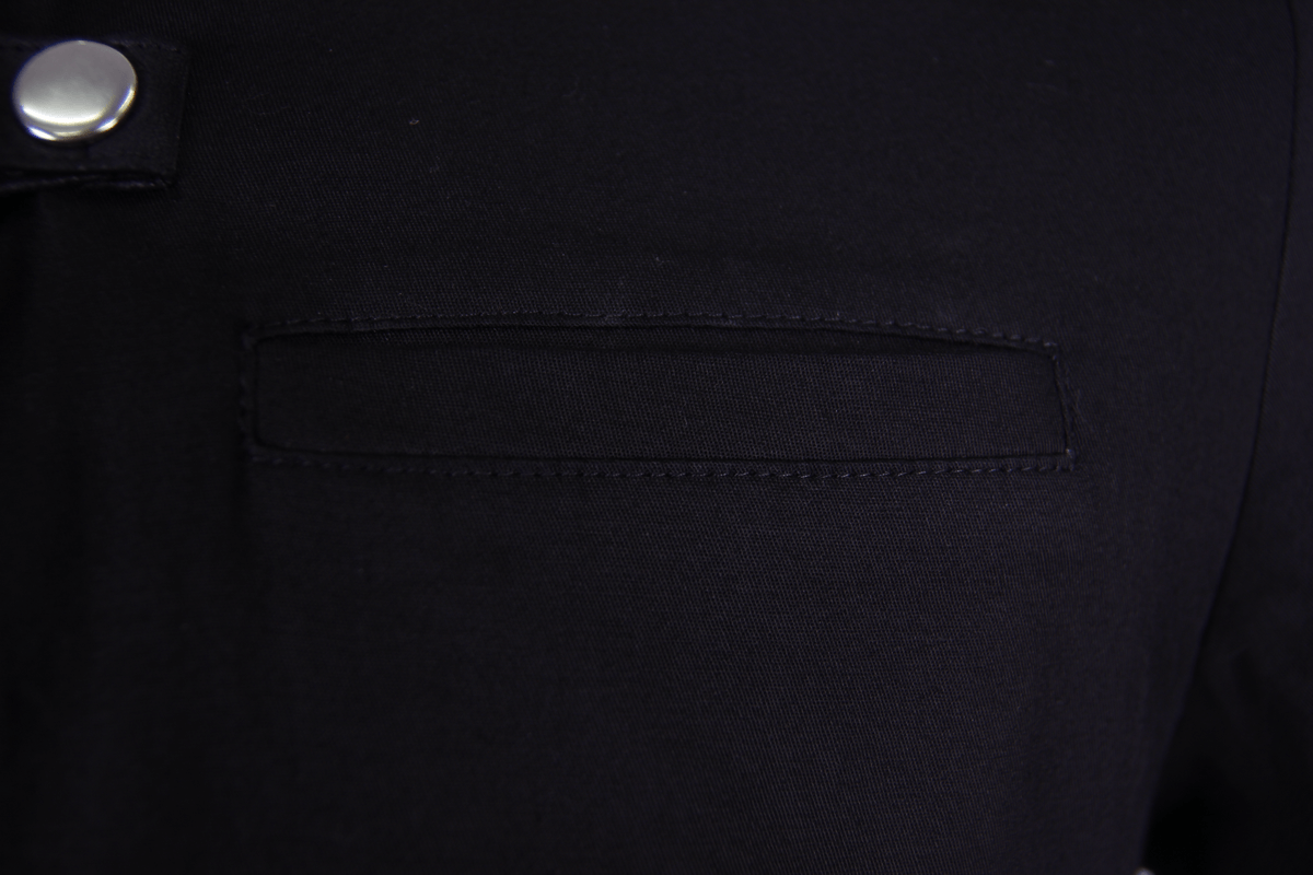 Close-up of black gothic punk short-sleeve shirt collar with metallic button detail.