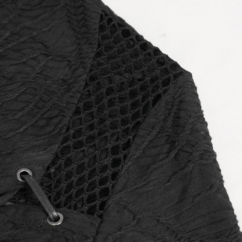 Close-up of black gothic crop top with textured fabric and mesh detailing, showcasing trendy style and unique design.