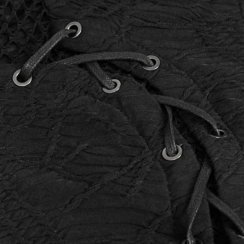 Close-up of black fabric featuring laced details and eyelets, highlighting gothic fashion design elements.