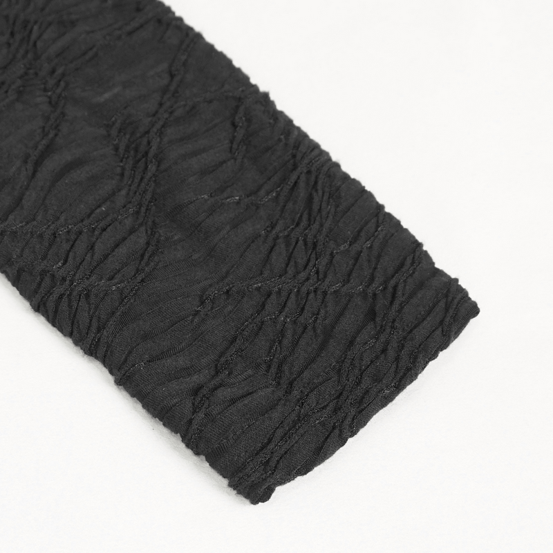 Close-up of black textured fabric with gathered detailing, showcasing a gothic-style design for women's clothing.