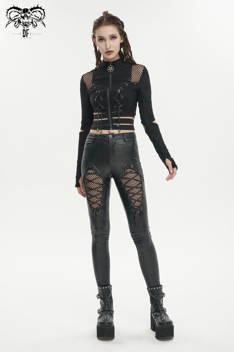 Black gothic woman in a stand collar zip crop top with split long sleeves, paired with edgy ripped leggings and chunky boots.